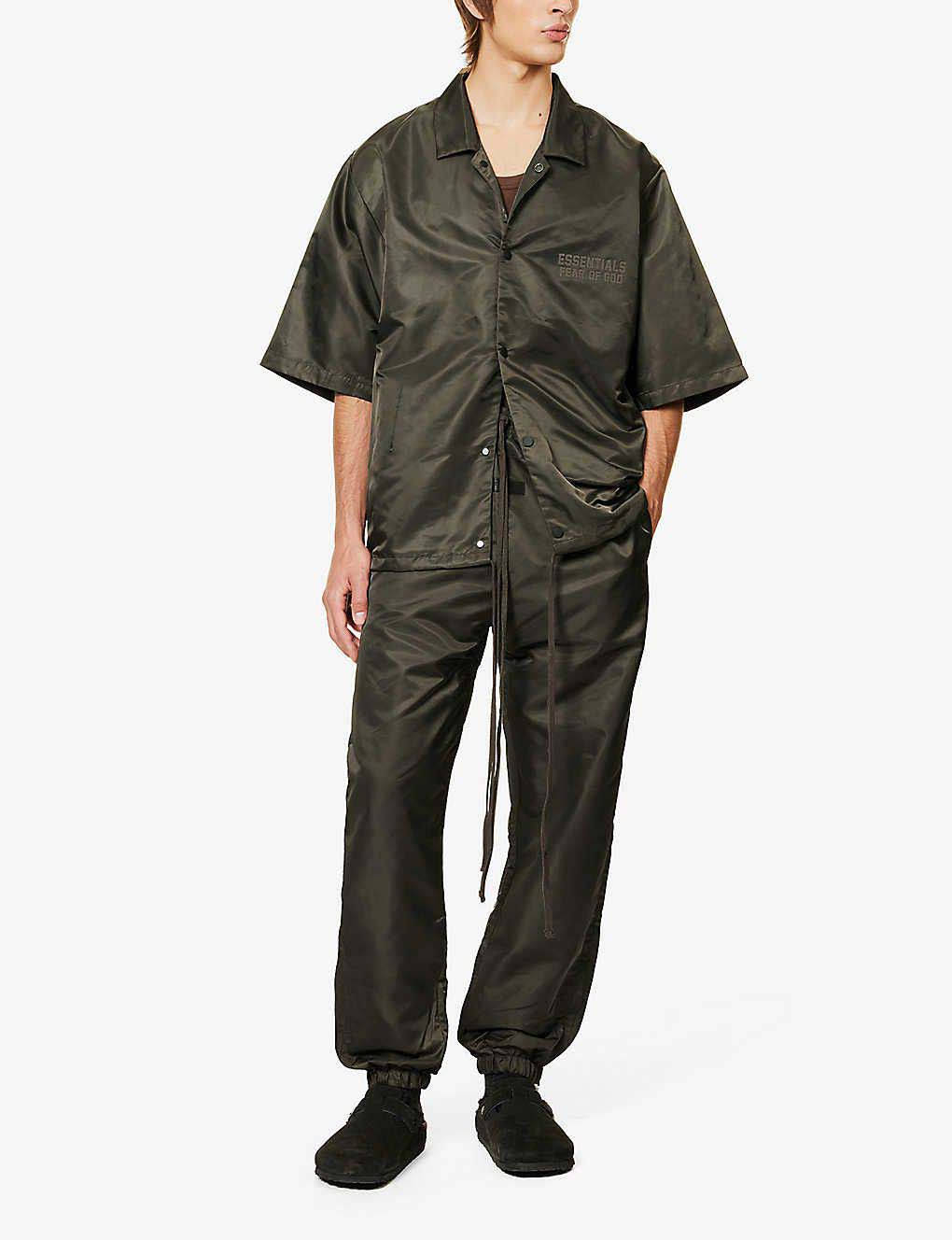 Fear of God ESSENTIALS Tapered Shell Jogging Bottoms Off Black Full