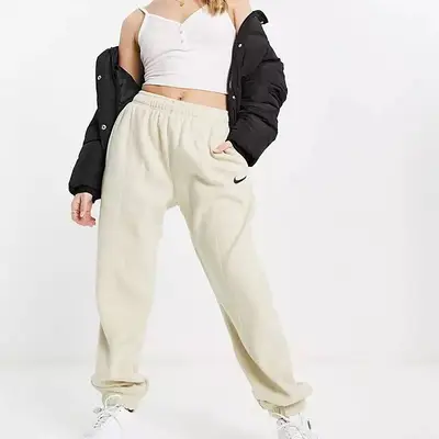 Nike Mini Swoosh Oversized Joggers In Tawny Brown from ASOS on 21 Buttons