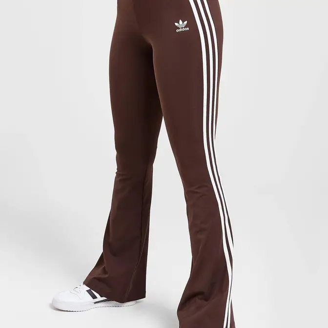 https://cms-cdn.thesolesupplier.co.uk/2023/01/adidas-originals-flare-leggings-brown-front_w672_h672.jpg.webp