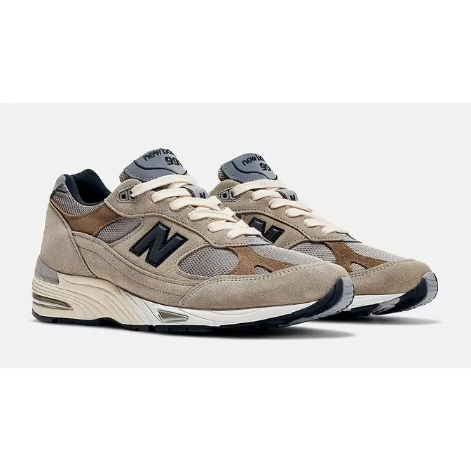is back with another New Balance collaboration and this time around Grey Brown Womens W991JJA Side