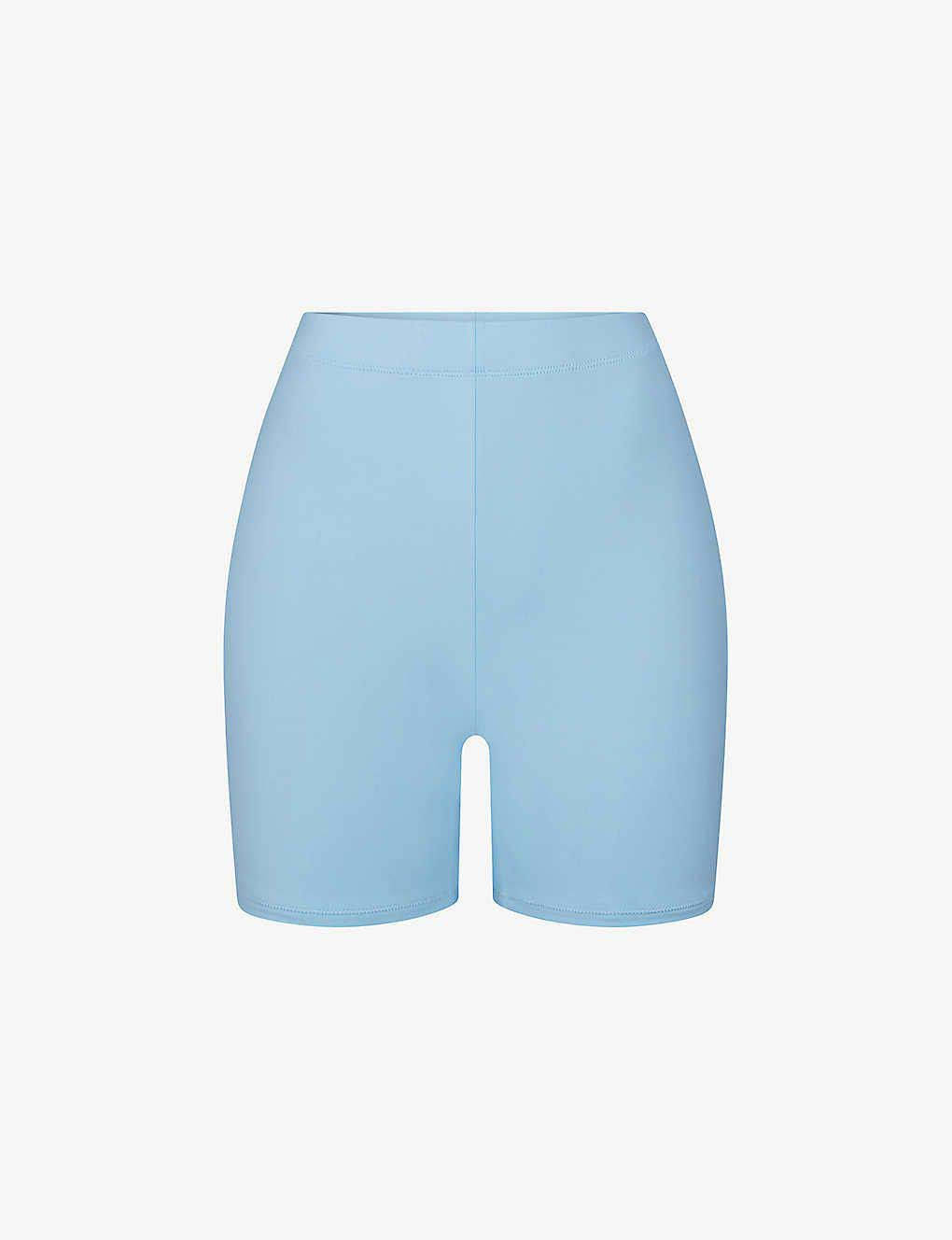 https://cms-cdn.thesolesupplier.co.uk/2023/06/skims-swim-recycled-stretch-nylon-swim-shorts-iris-blue.jpg