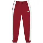 Sporty _ Rich x Lacoste Pique Track Pant Pinot Feature
