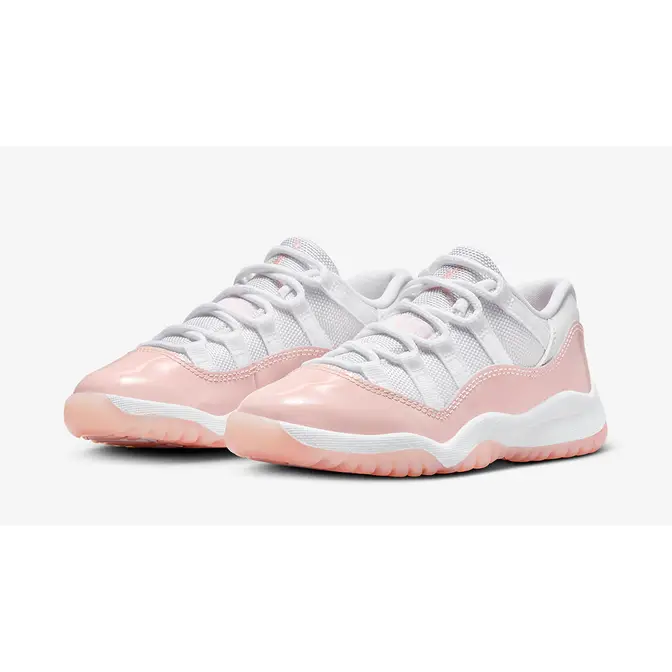 Pink and white low top 11s on sale