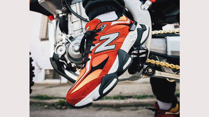 DTLR x New Balance 9060 Fire Sign on foot closeup