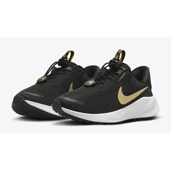 Black and metallic store gold nike shoes