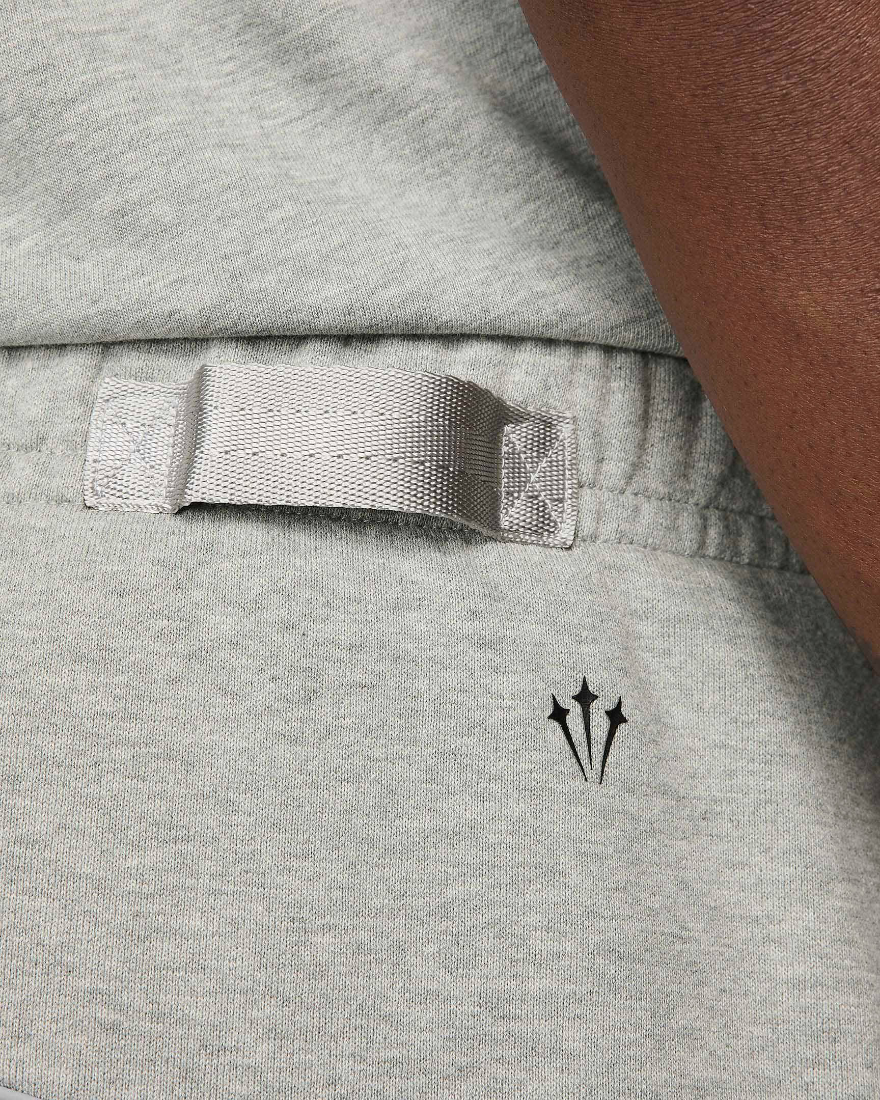 NOCTA x Nike Open-Hem Fleece Trousers Dark Grey Heather Back Closeup