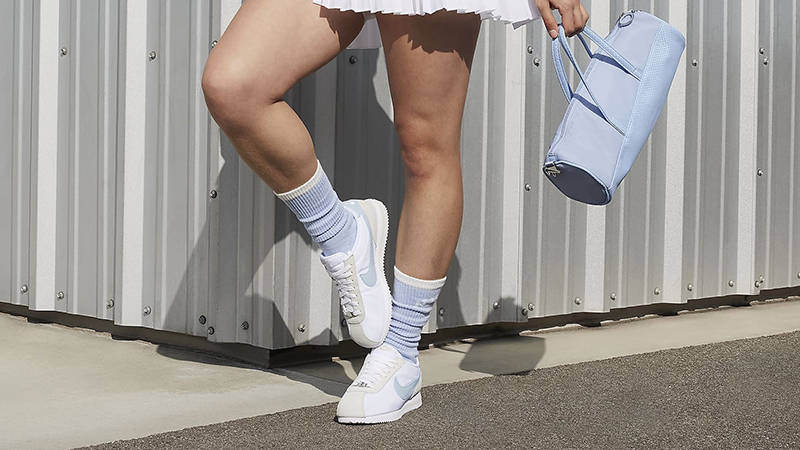 all white nike cortez on feet