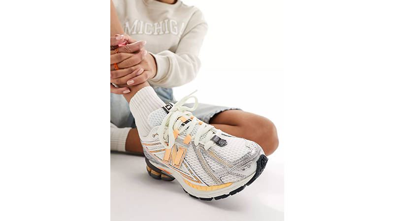 New Balance 1906 silver neon orange on foot front