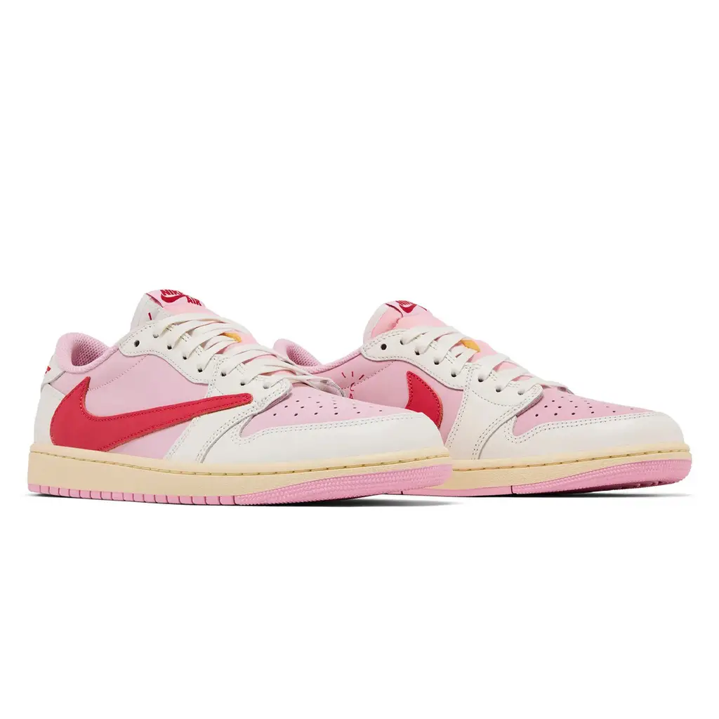 Travis Scott x Air Jordan 1 Low OG Tropical Pink pair shot showing both shoes with pink nubuck and sail midsole