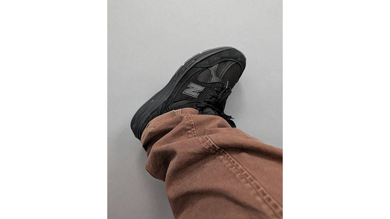 Stone Island x New Balance 991v2 Black on foot