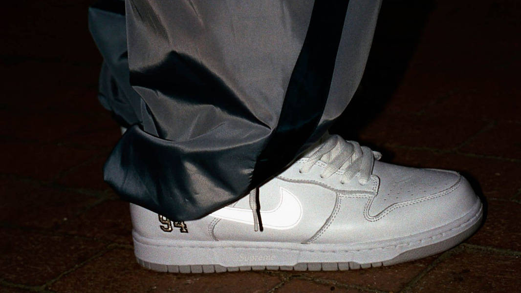 Supreme x Nike SB Dunk Low White On Foot Side