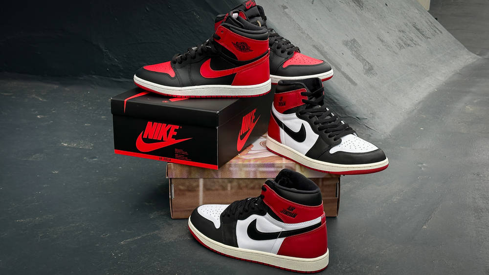 Too Many Jordan 1s? How Nike’s Strategy Could Be Hurting the Legacy Jordan 1 Bred '85 paired with the Air Jordan 1 Reimagined Black Toe sat on each of their limited edition boxes showing lateral and medial sides of the Jordan 1