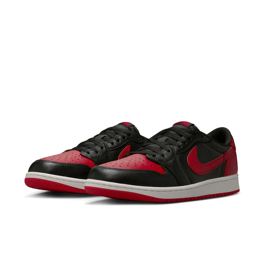 Air Jordan 1 Low OG Banned IW6276-001 hero image showing black and Varsity Red Bred colourway with red X heel detail