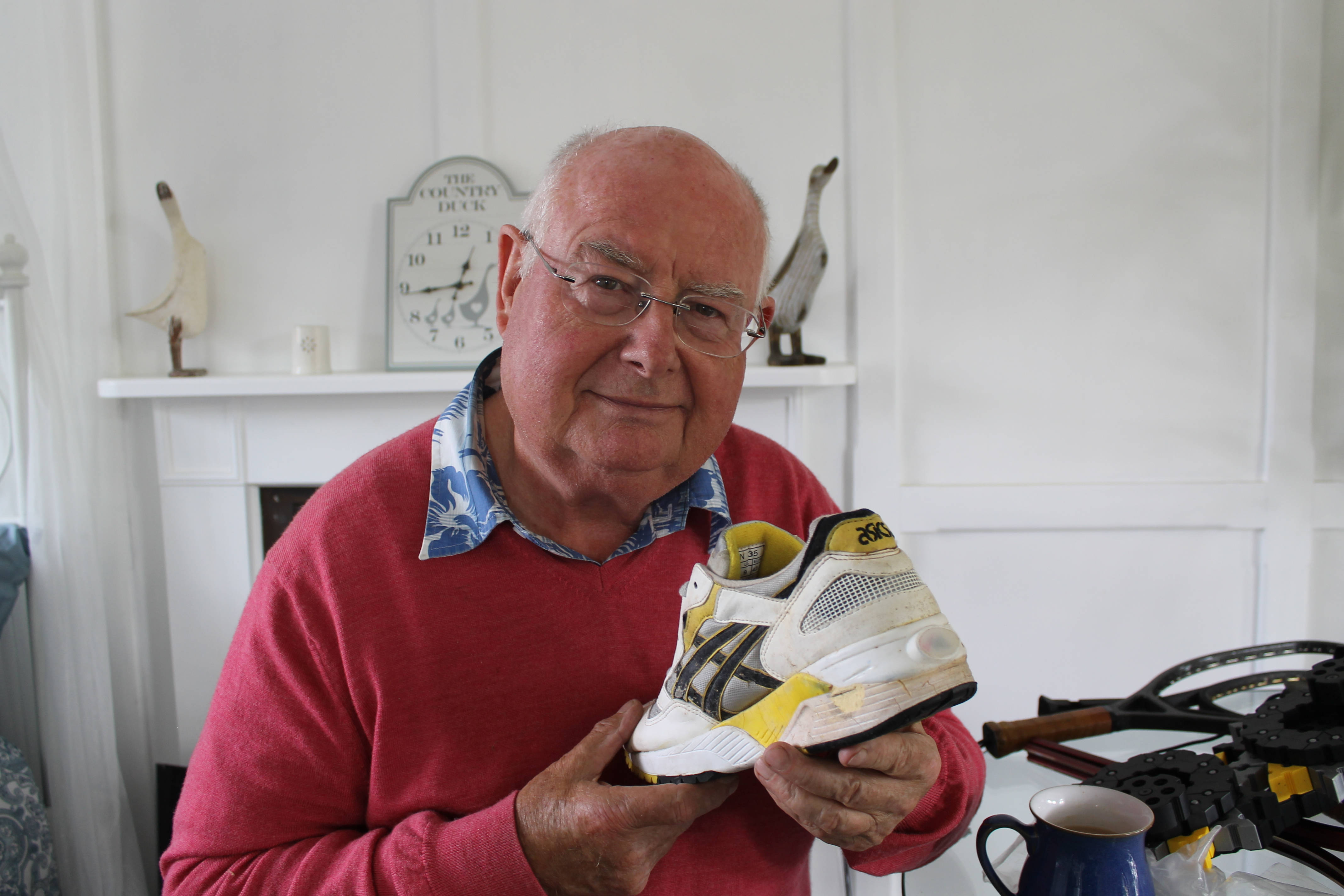 John Mott holding ASICS GEL NITE LYTE white and yellow preproduction sample