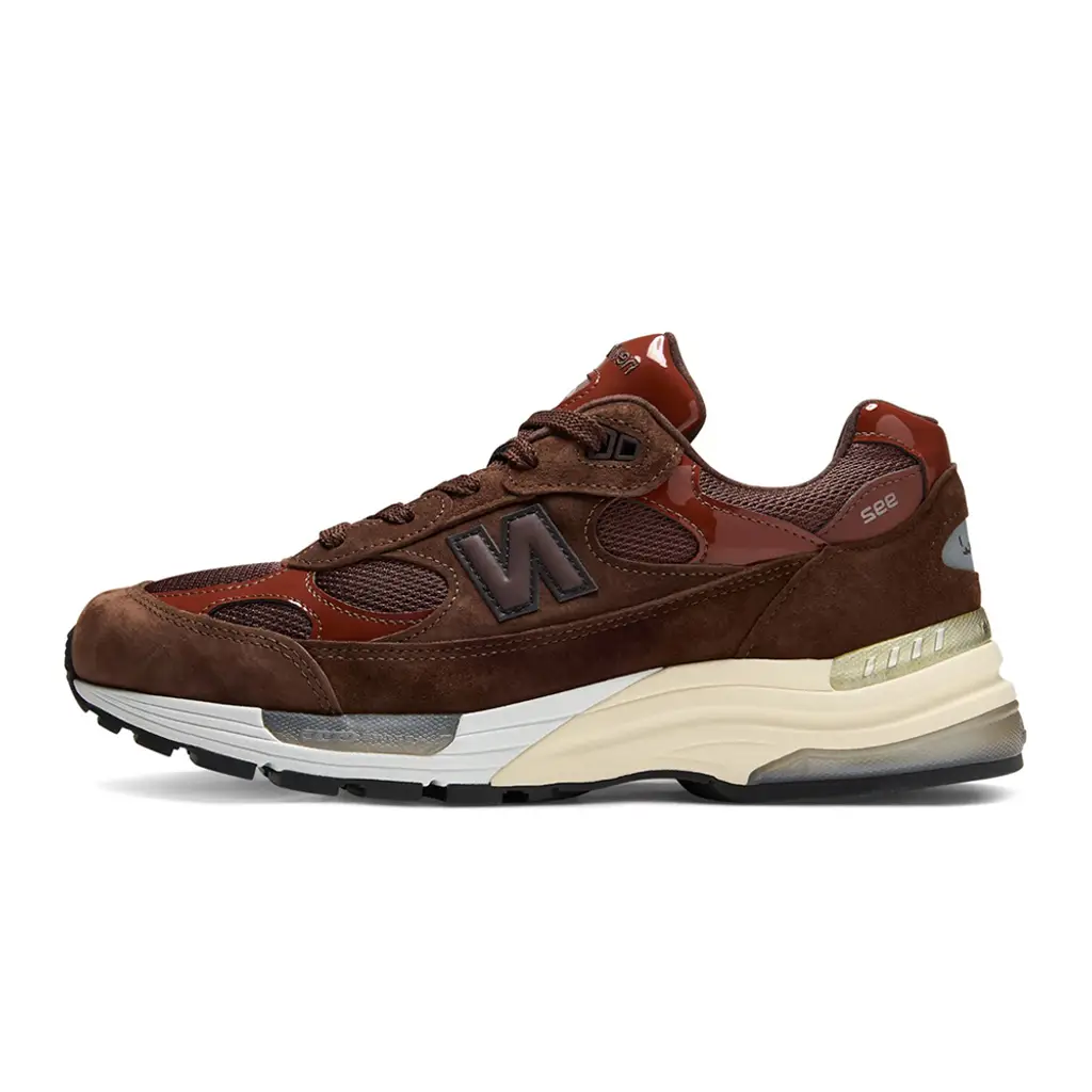 Aminé x New Balance 992 Outdoor School lateral view showing mesh underlays suede overlays and glossy hickory patent leather panels