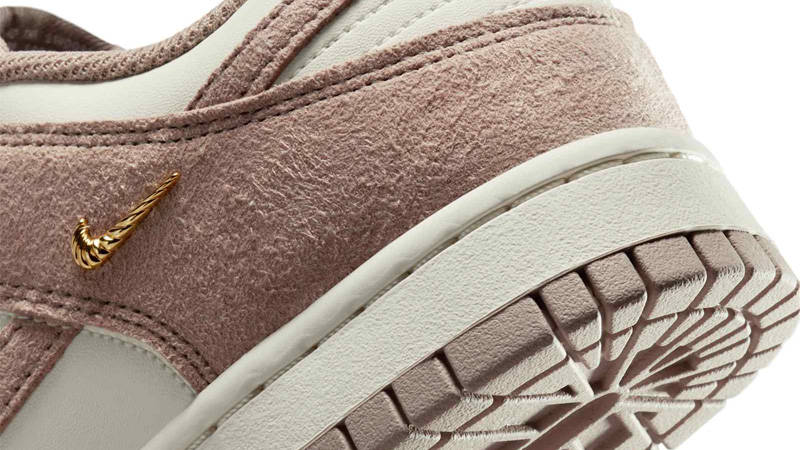 Nike Dunk Low Malt Gold Mini Swoosh Closeup