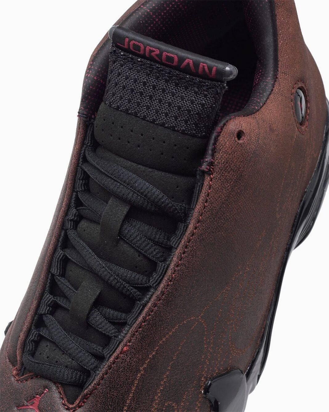 The Mowalola x Air Jordan 14 Black Burnt Red tongue