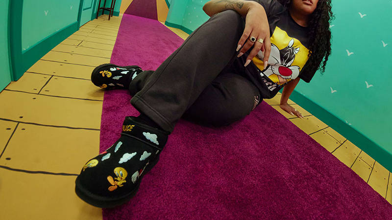 Palace x UGG Classic Ultra Mini Boot Looney Tunes Tweety Black on foot