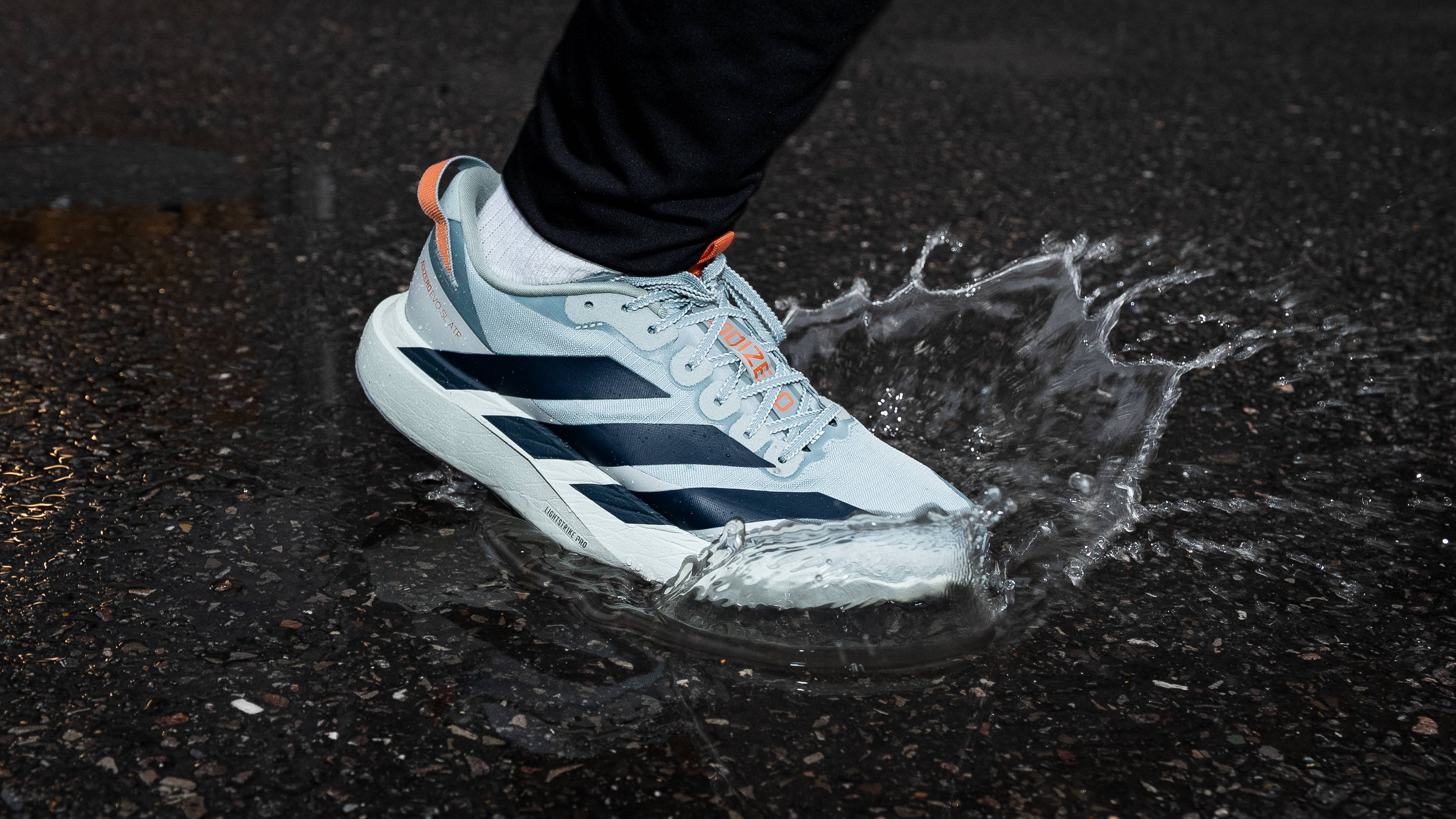 adidas Adizero EVO SL ATR Wonder Sage Ink mid-stride paddle splash on asphalt floor