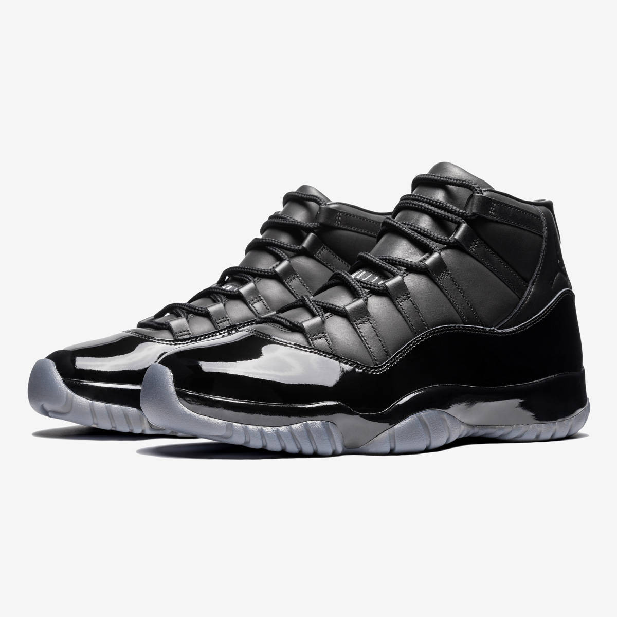 Comme des Garçons x Air Jordan 11 Black Pair