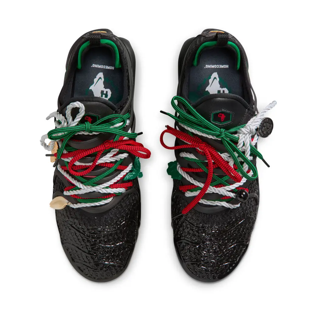 HOMECOMING x Nike Air Max Plus Pan-African midfoot detail showing detachable charms and three lace sets