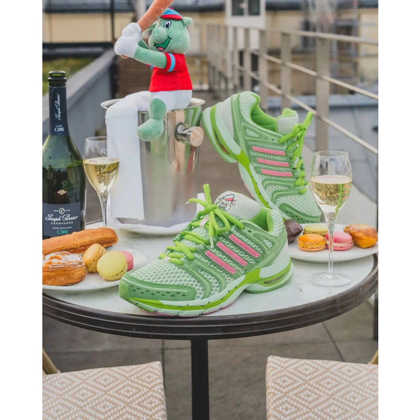 Unheardof x adidas Adistar Control 5 Piggy Runner 2.0 Green on table
