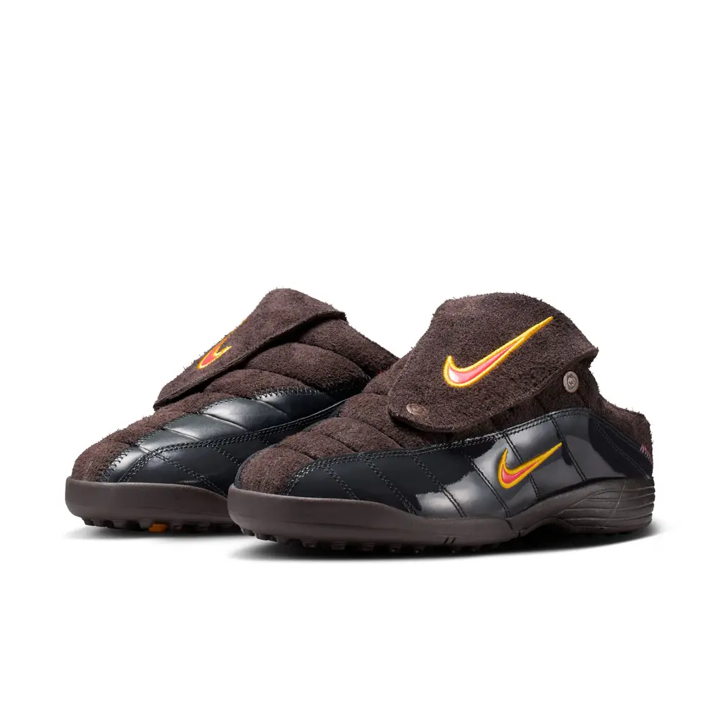 Kids of Immigrants x Nike T90 Mule Velvet Brown IH4422-201 front view showing dark chocolate suede with orange and red accents and snap-on tongue