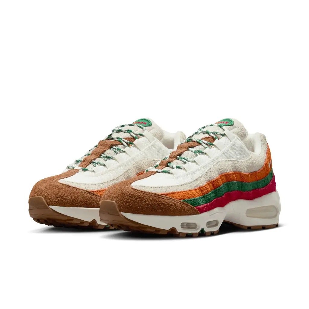 Nike Air Max 95 7-Eleven IR1944-102 hero image showing hairy suede upper with Gym Red Sport Green and Total Orange side panel striping and Light British Tan accents