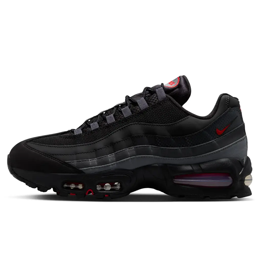 Nike Air Max 95 Black Red Anthracite lateral view showing dark greyscale layered side panels and red-tinted Air unit