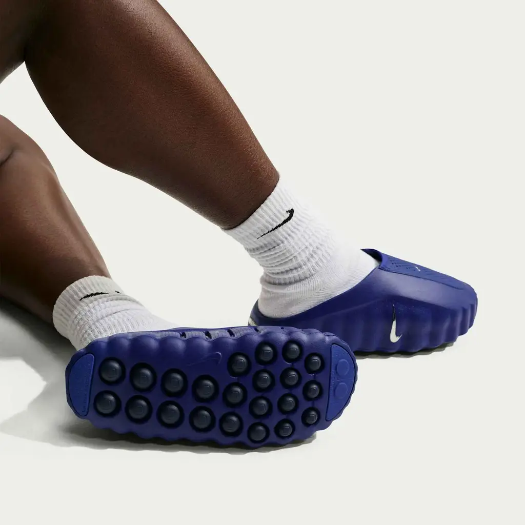 Nike Mind 001 Slide Old Royal HQ4309-400 hero image showing tonal royal blue mule upper with Midnight Navy outsole nodes and metallic silver Swoosh