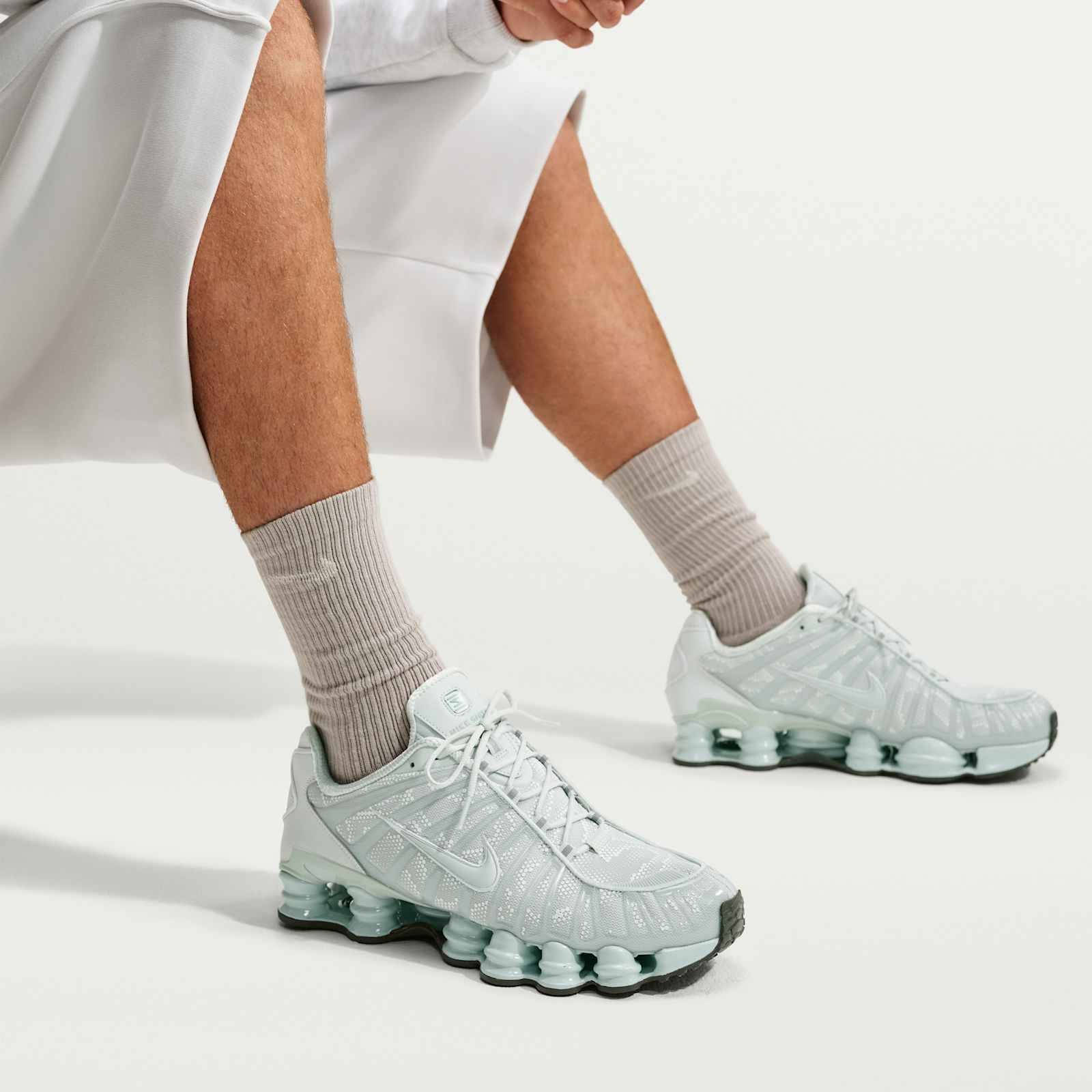 Nike Shox TL Light Silver Newsprint IM4687-002 on foot