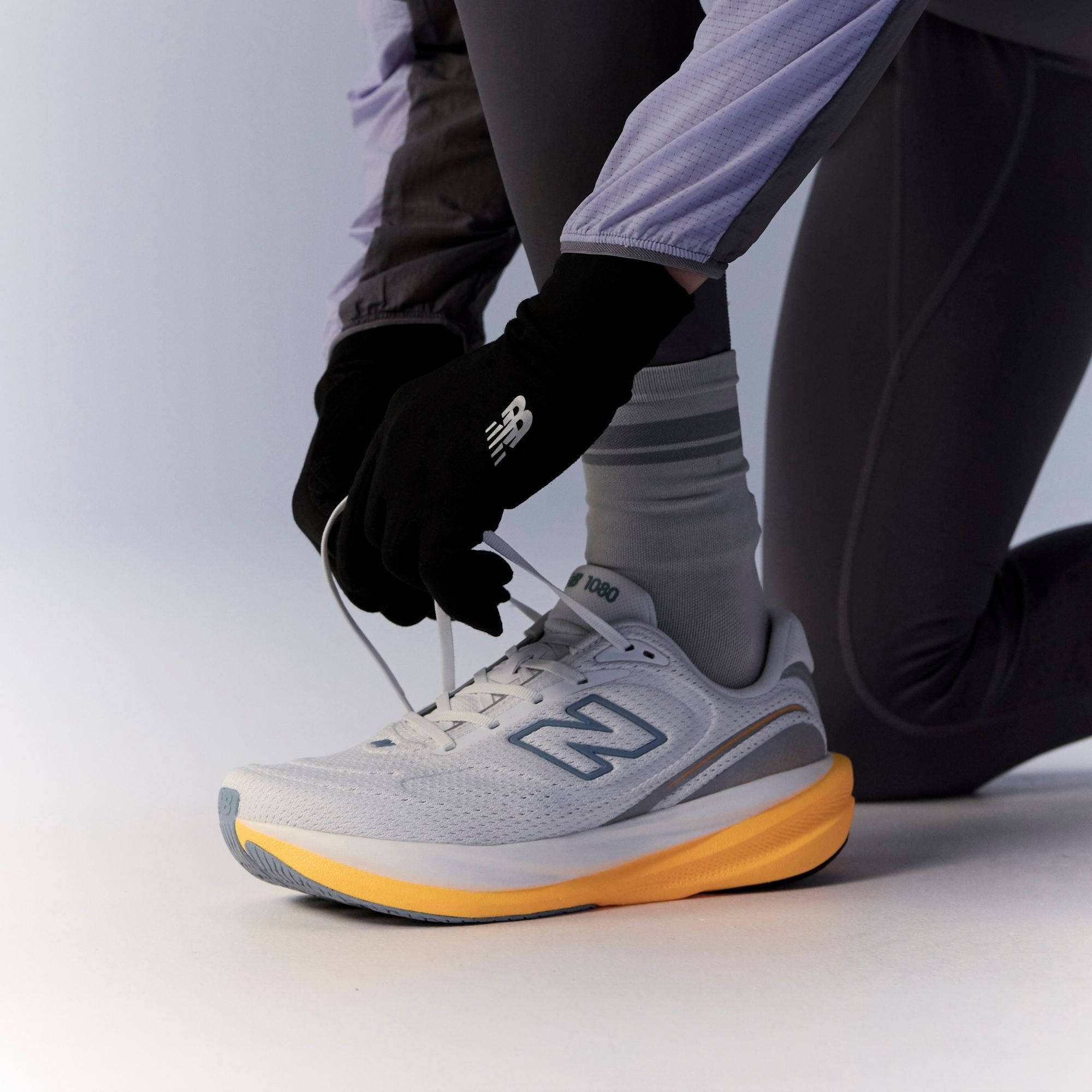 New Balance 1080 v15 White Satsuma Orange M108098N on foot