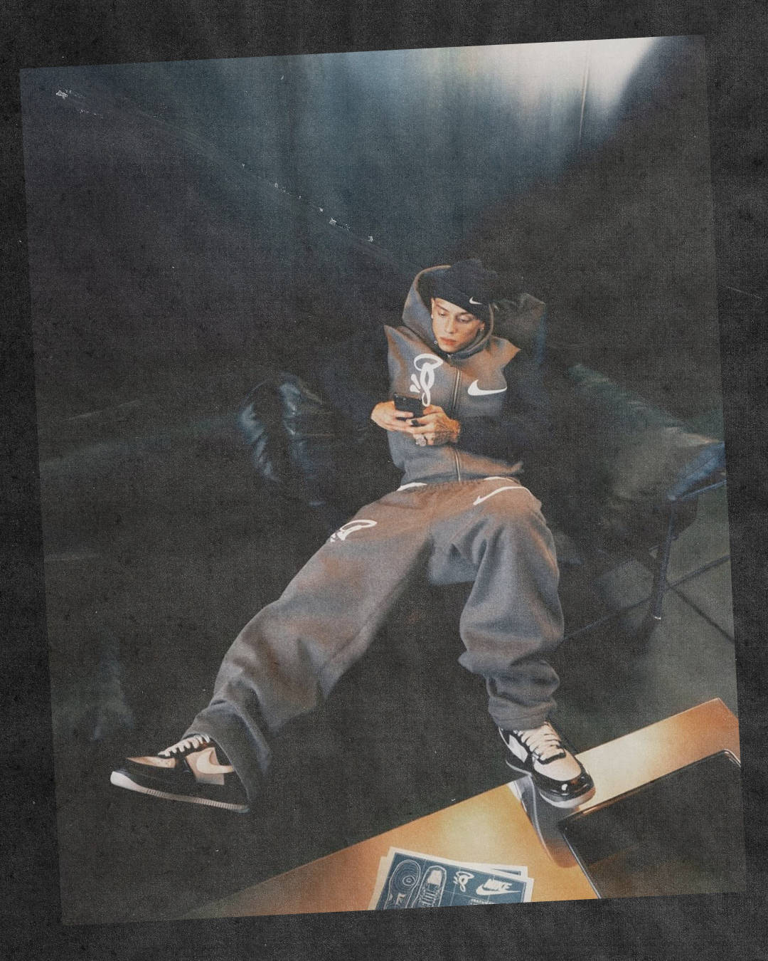 Central Cee layed on couch wearing Syna World x Nike Air Force 1 Black Grey
