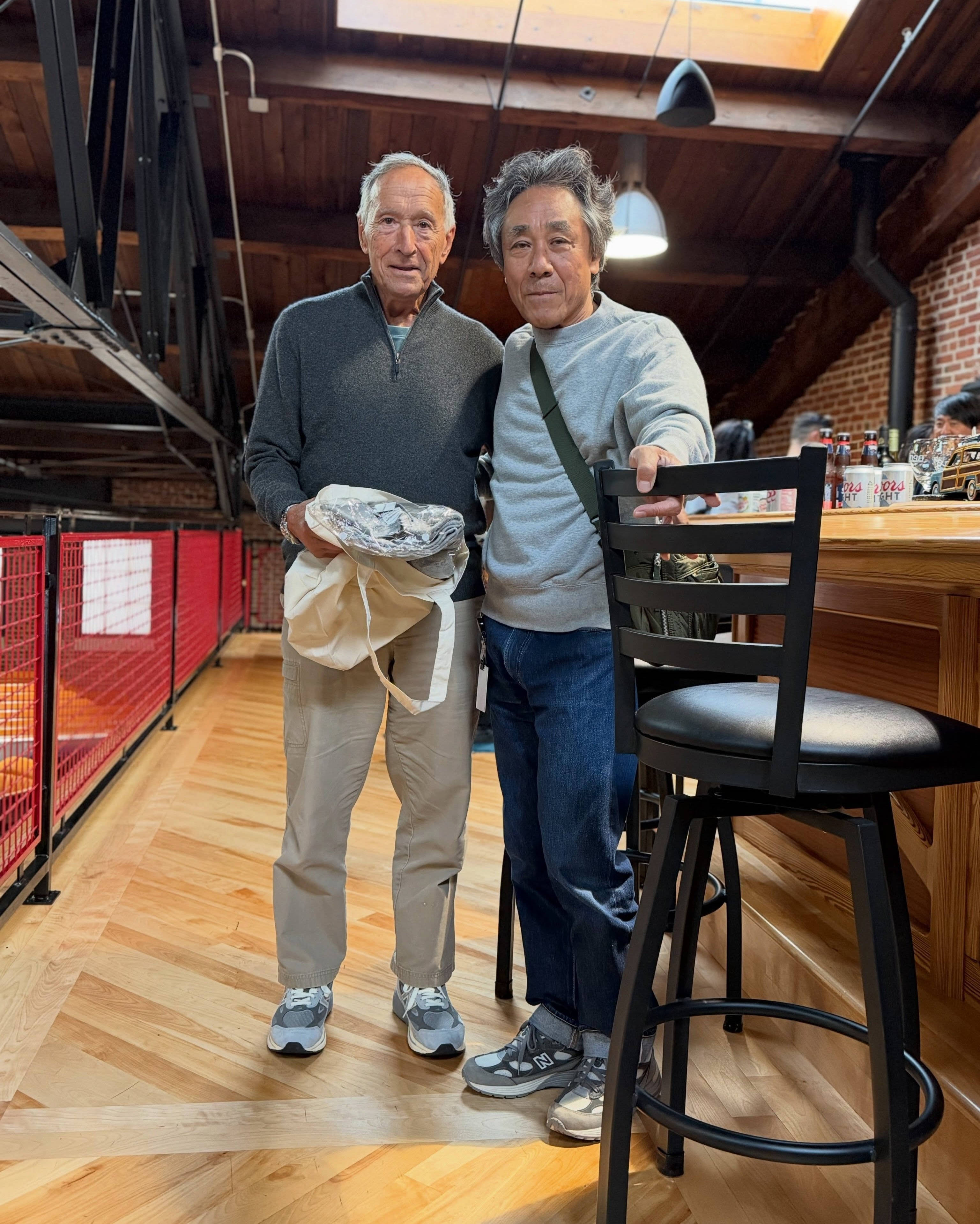 loopwheelerss aka SATOSHI SUZUKI stood next to President of New Balance Joe Preston