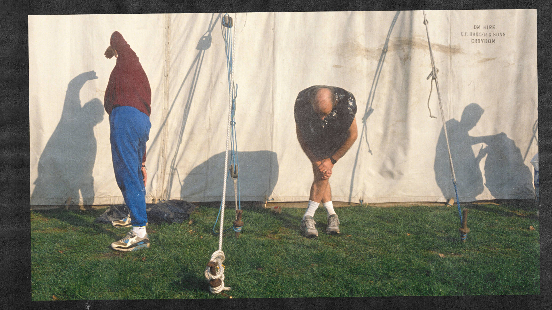 Two running veterans stretching at the London Marathon in 1990 Greenwhich Park wearing air max 90 laser blue colourway