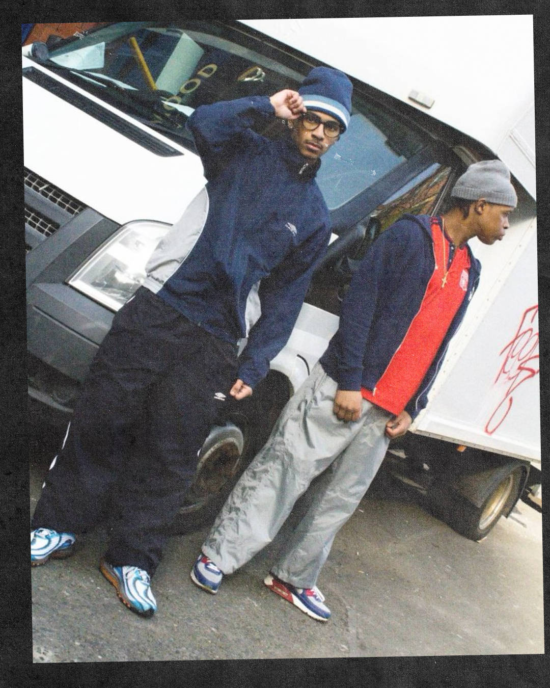 two guys posed by vans streetwear styled wearing air max 90 pirate radio editon and nike air max deluxe