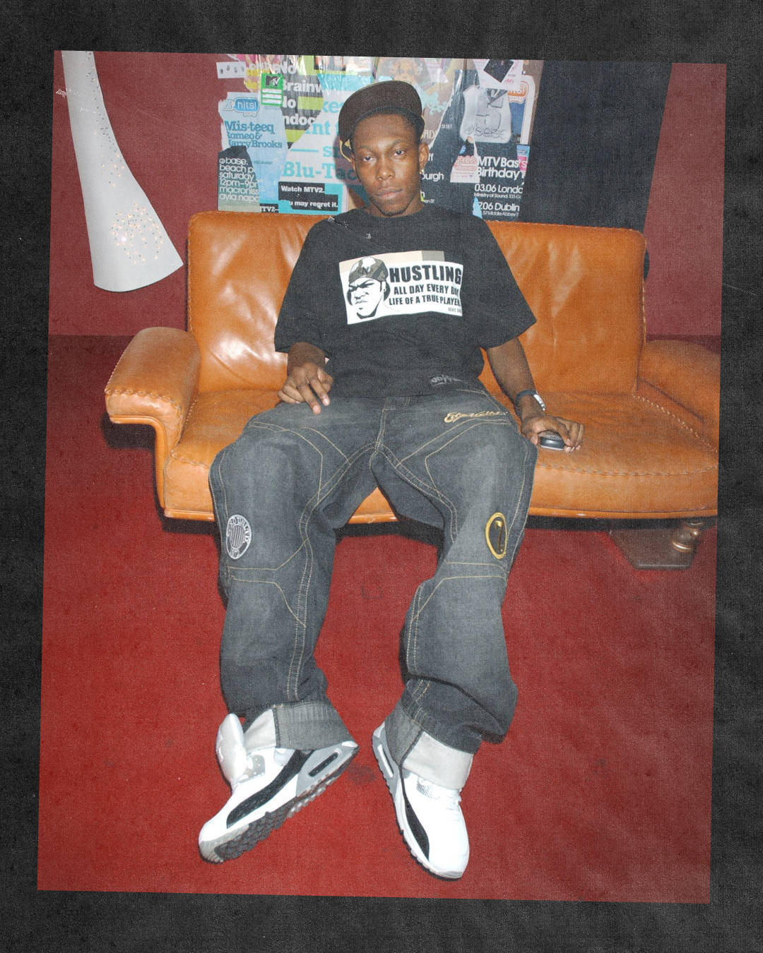 dizzee rascal performing on stage wearing air max 90 red white