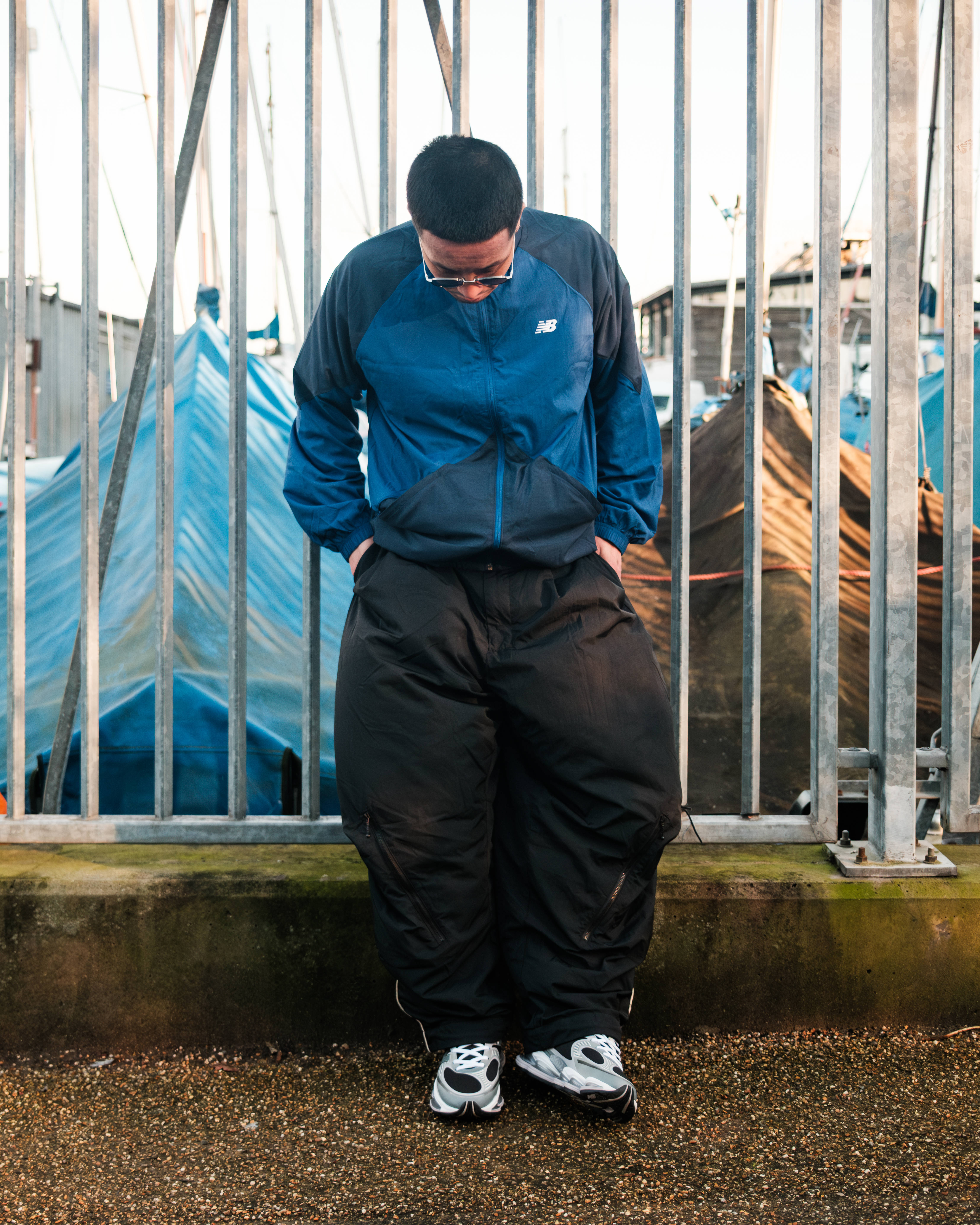 new balance abzorb 2000 styled by Geoffrey with fence backdrop