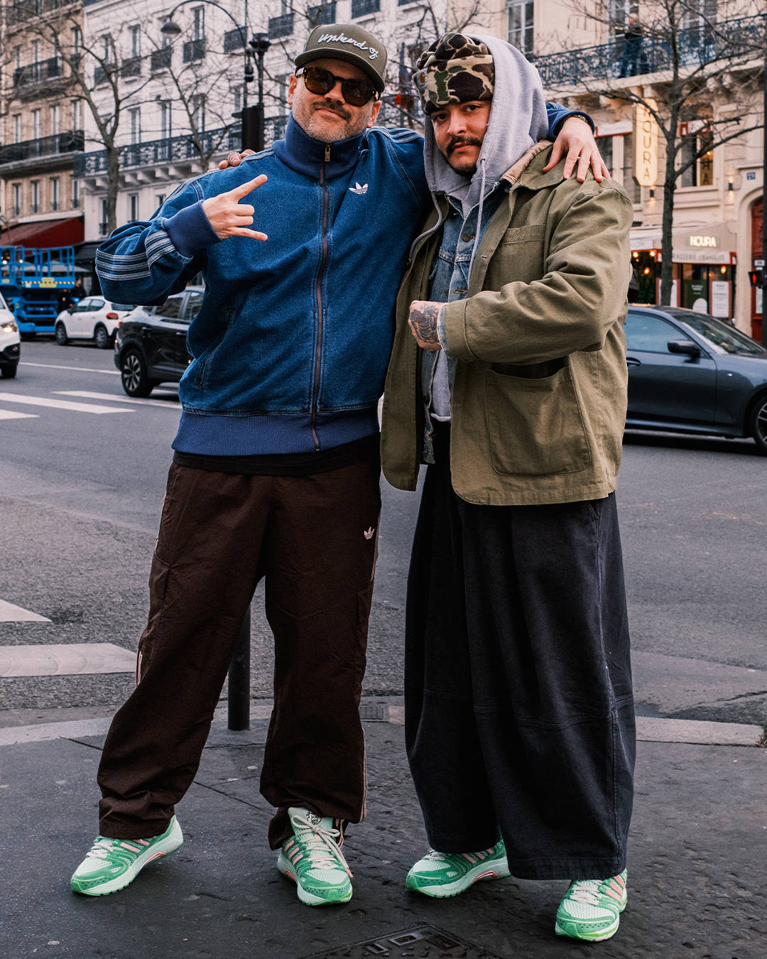 Unheardof founder and The Sole Supplier posing wearing the upcoming adidas Control 5 Piggy Runner 2.0 collab