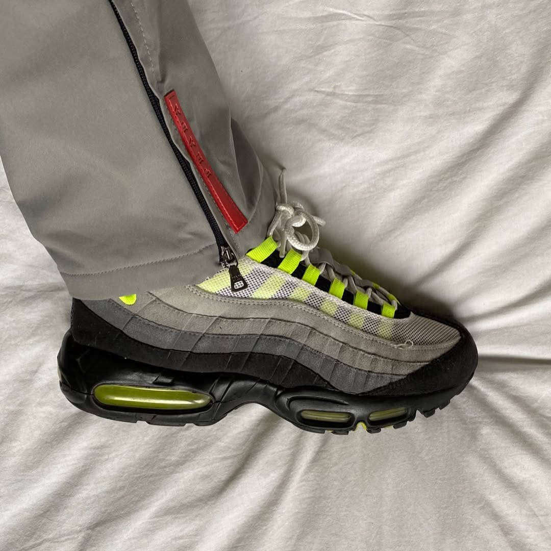 neon 110s paired with prada tracksuit bottoms