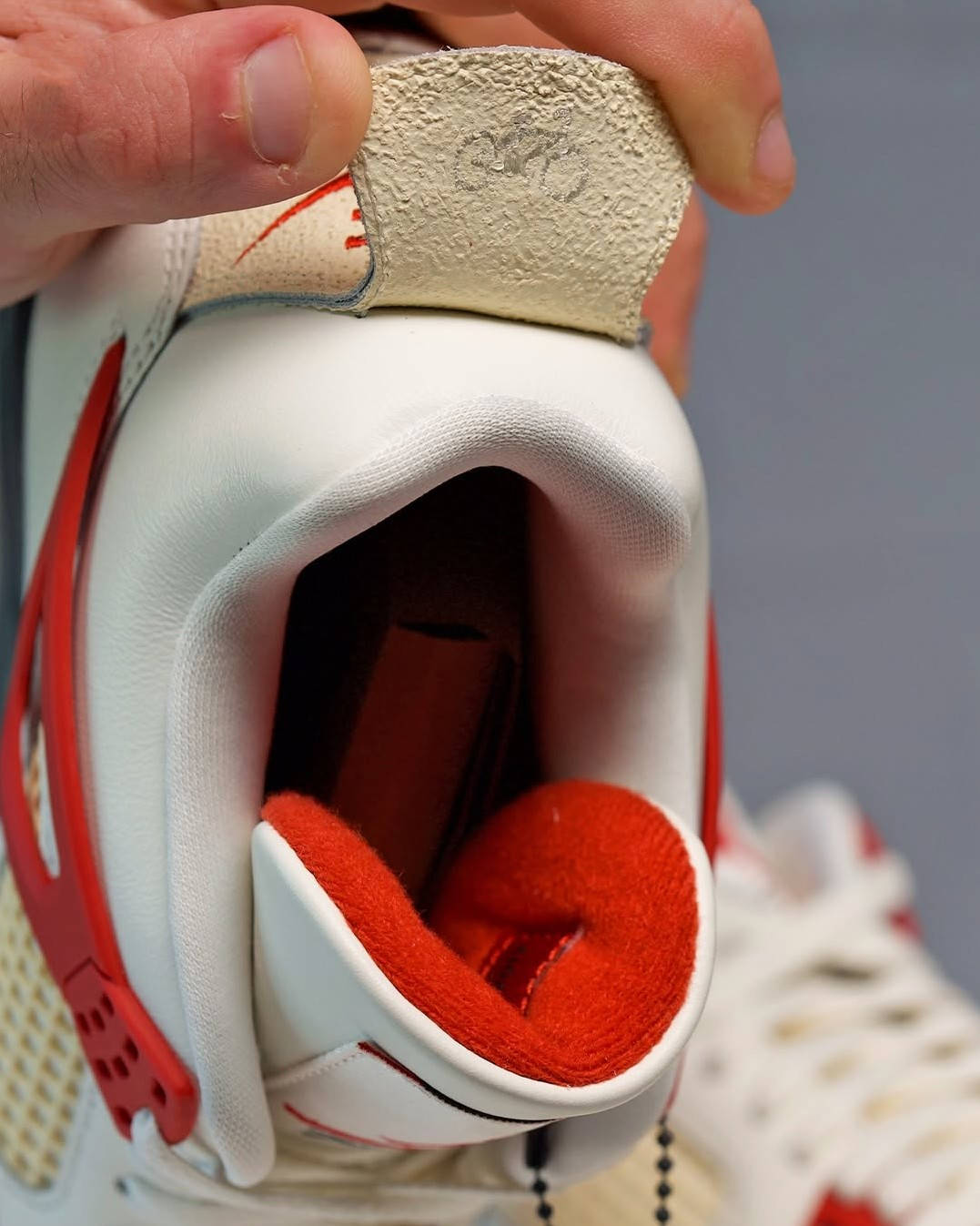 nigel sylvester x air jordan 4 sail cinnabar back tab detailing