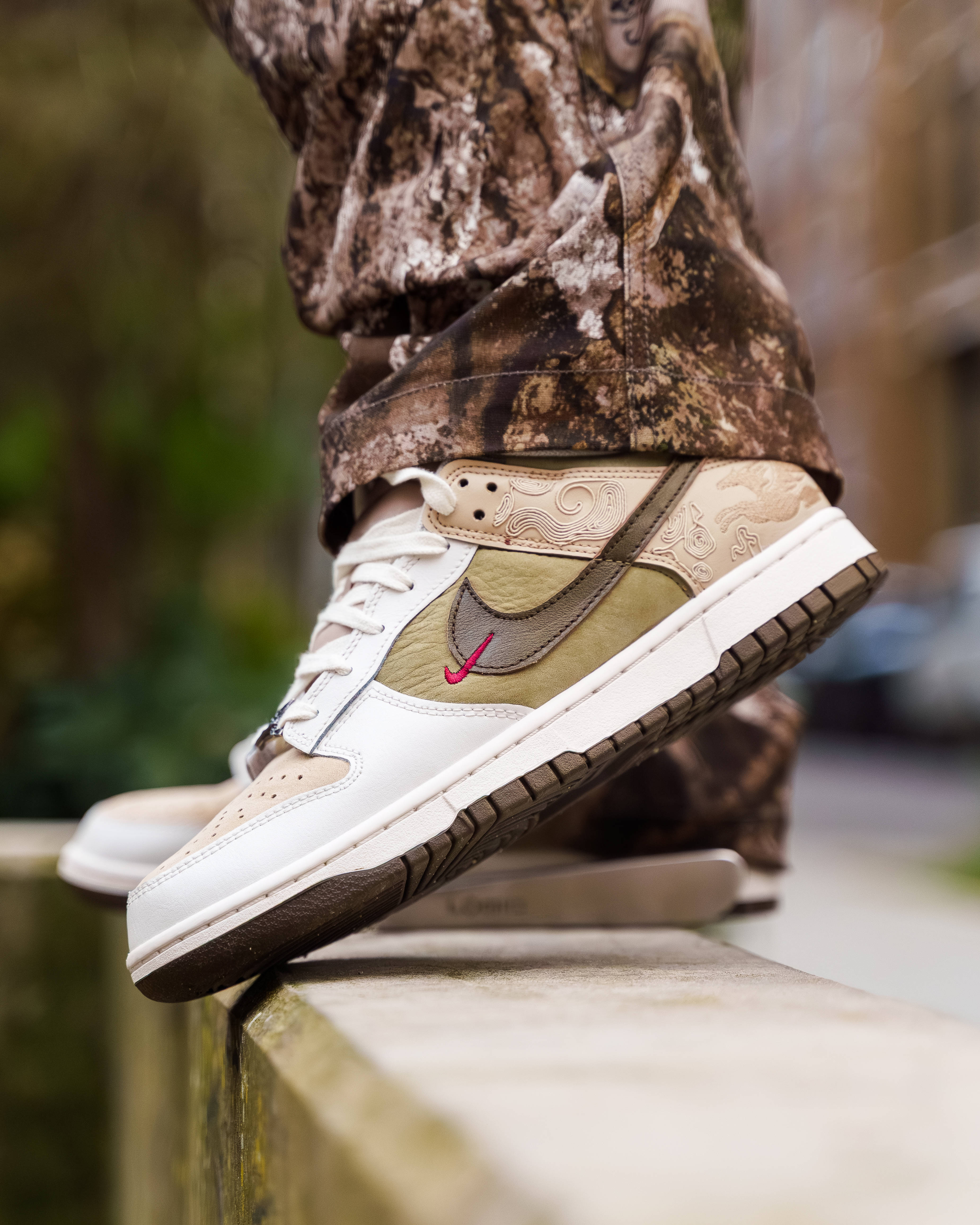 Nike Dunk Low Close-up with realtree camo trouser