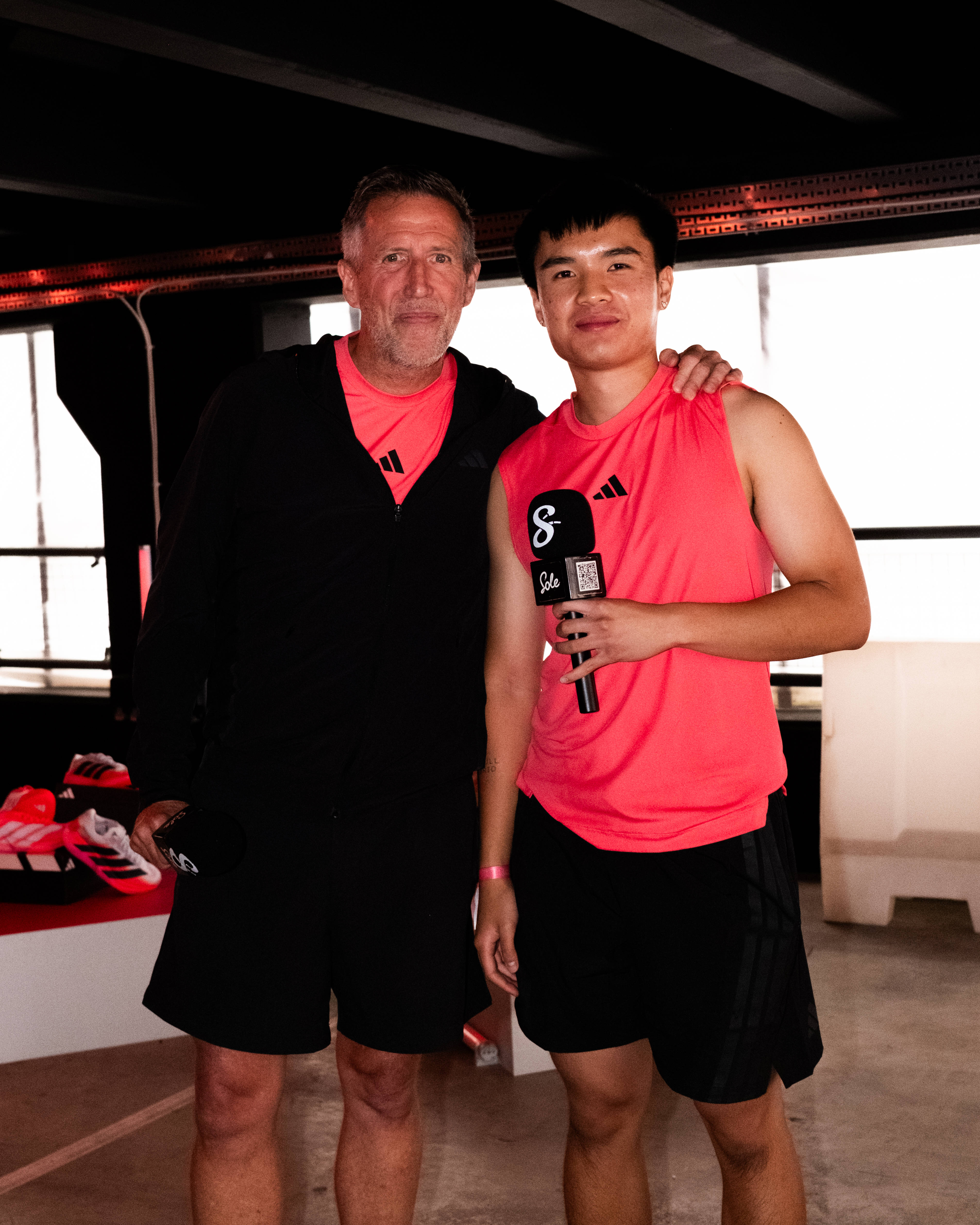 jeremiah and Chris Hinshaw stood side by side with the sole supplier branded microphone