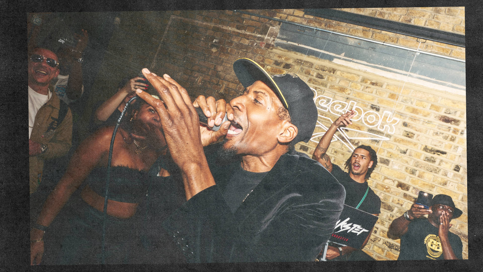 mc bushkin on the mic at his Oh My Mosch Reebok Book launch