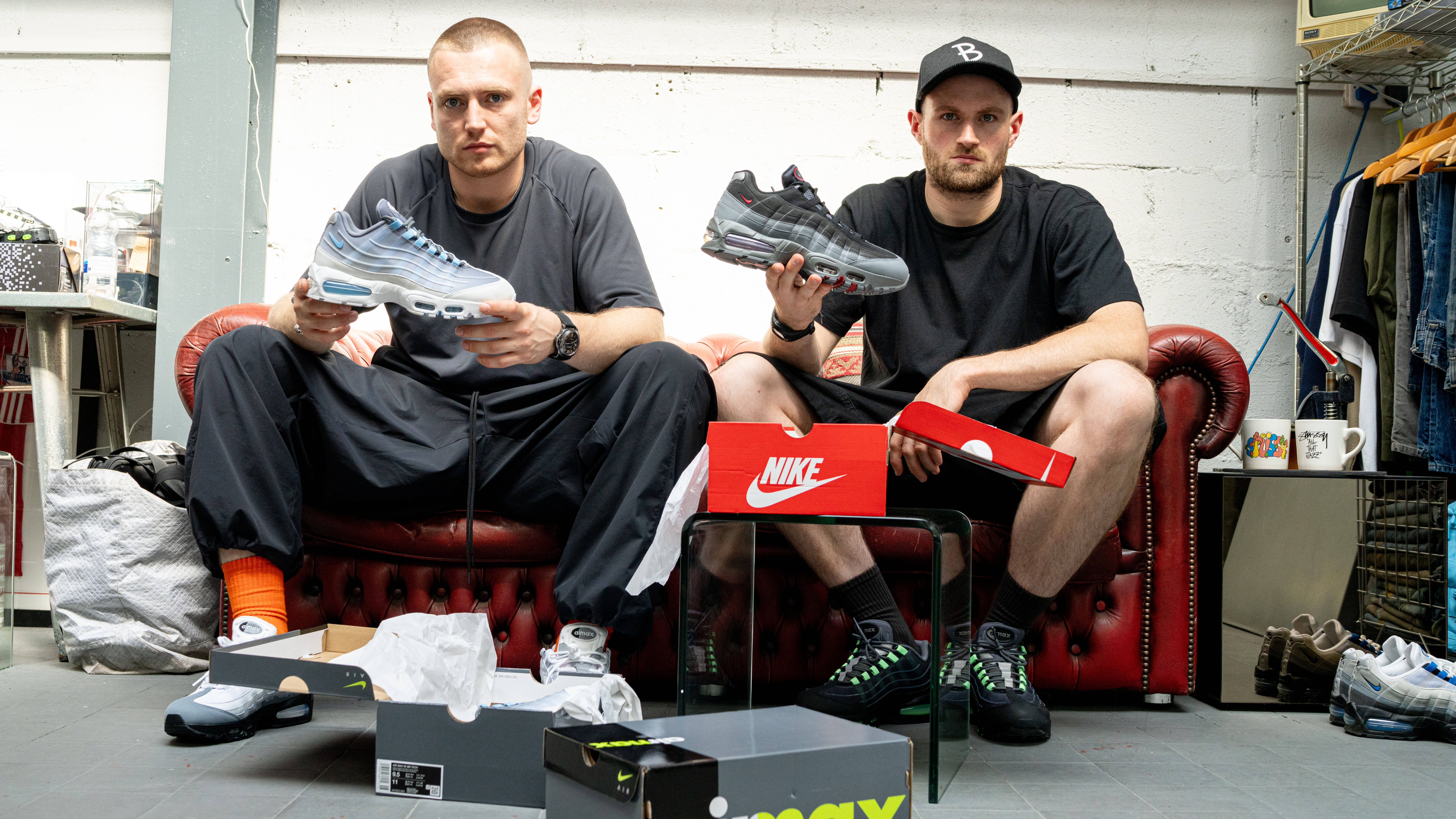 baggys tv at leeds studio holding up air max 95 with studio lighting subject sat down