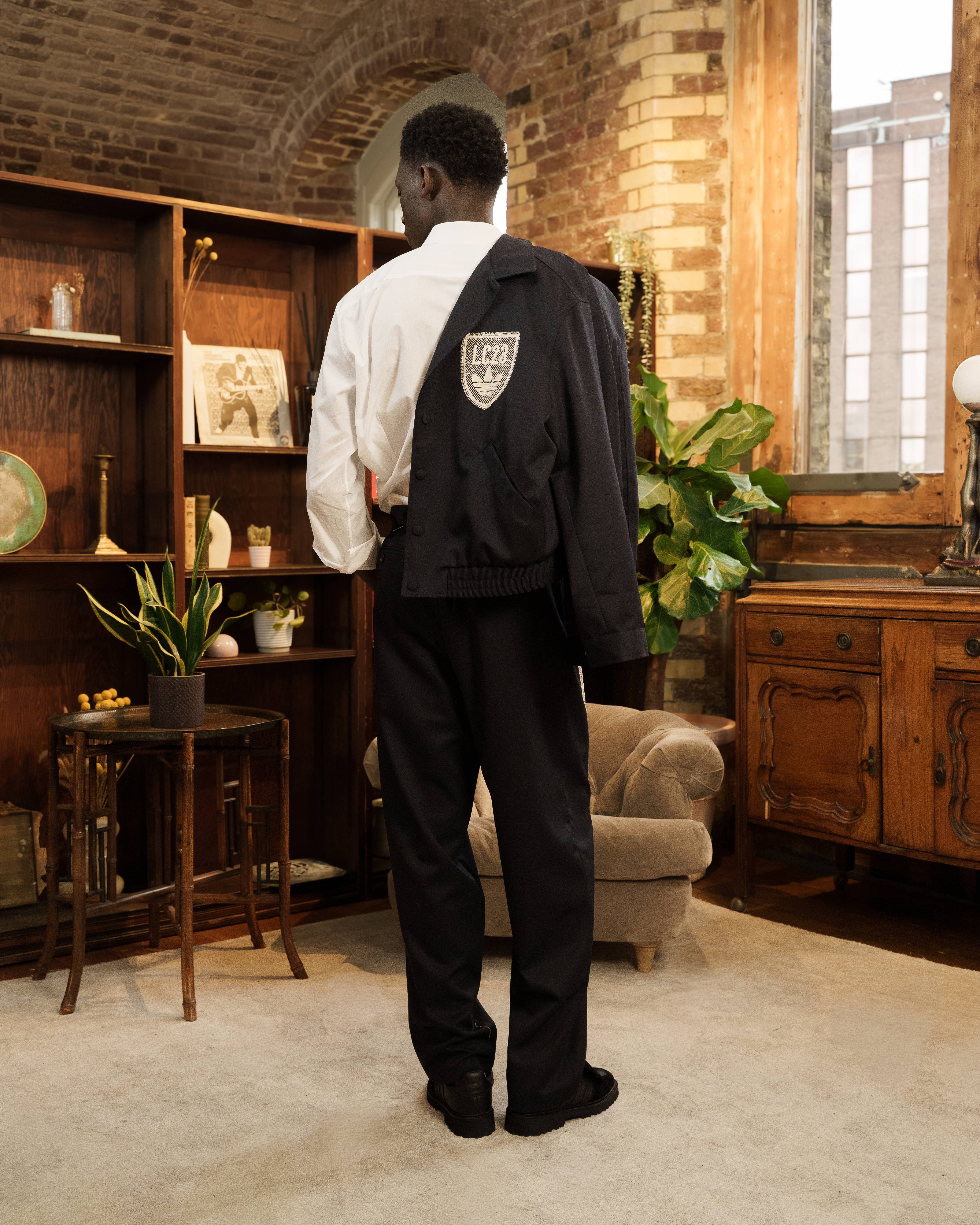 LC23 x adidas Originals clothing collection tracksuit on model editorial style