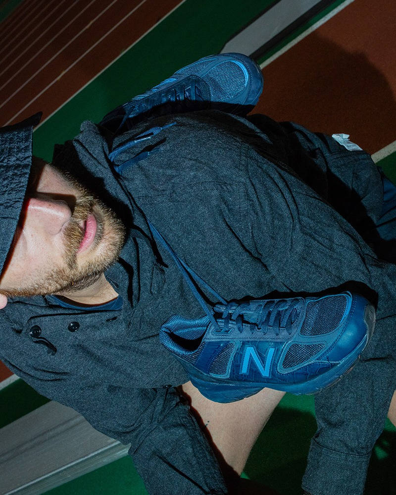engineered garments x new balance 990v5 navy slung over shoulder