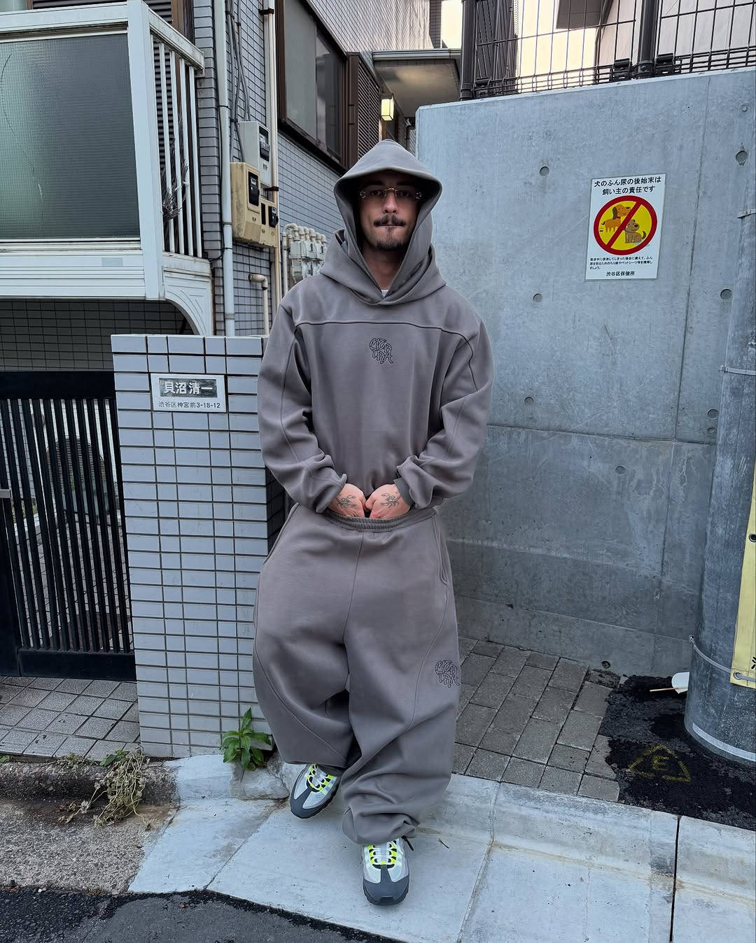 neon 110s styled with brown tracksuit