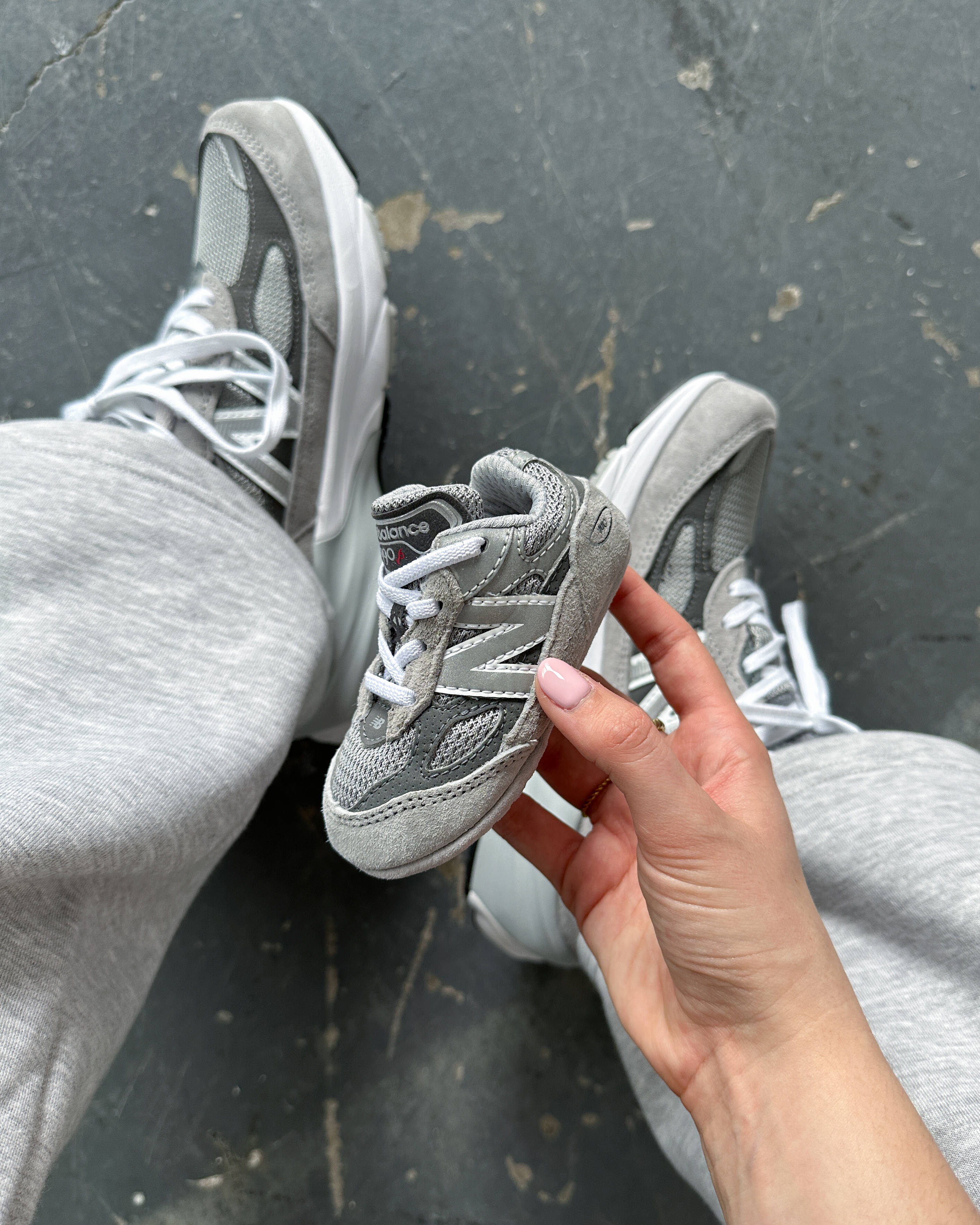 nb990v4 grey adult versus baby sizing in-hand photo