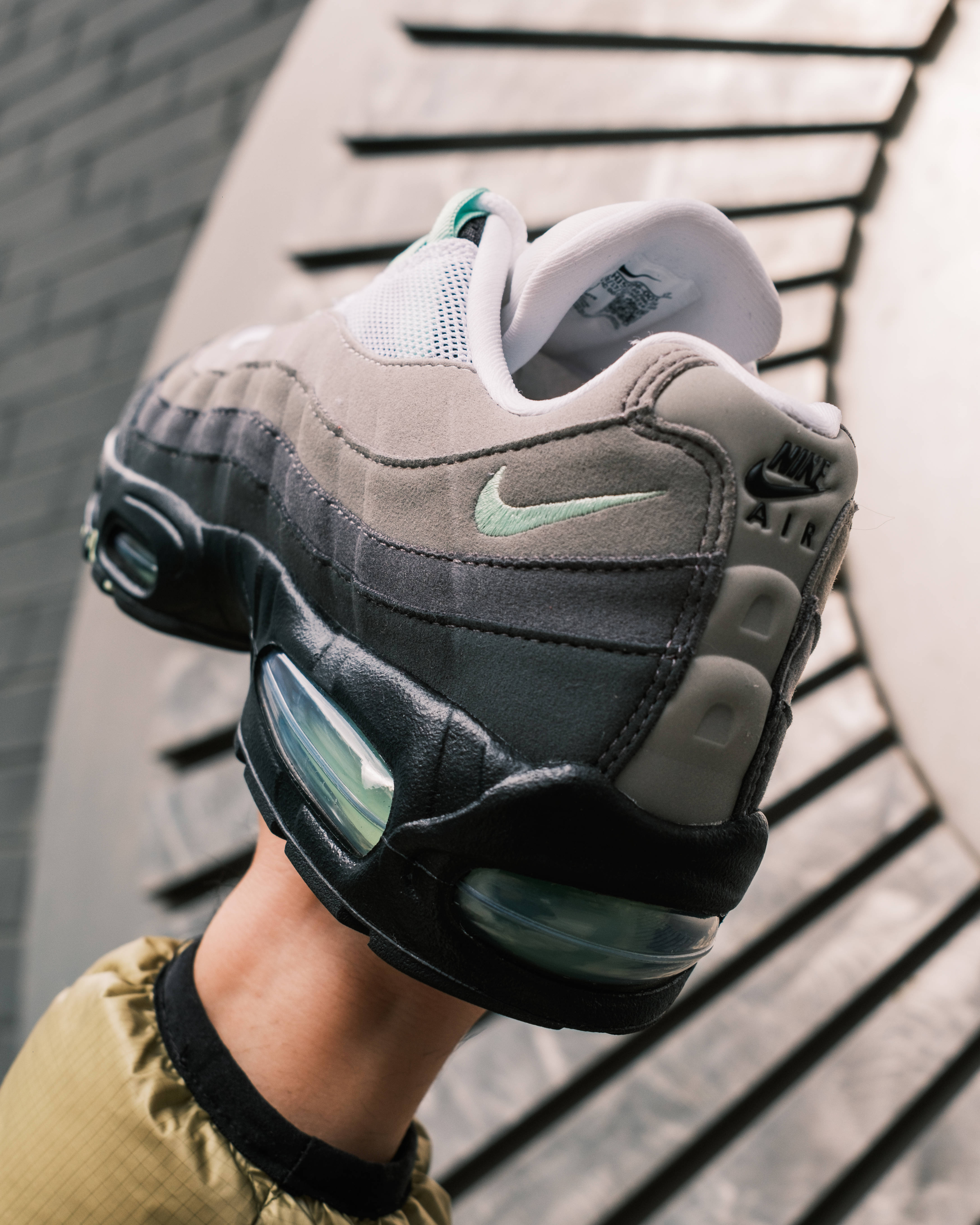fresh mint 110 rear in hand shot urban background
